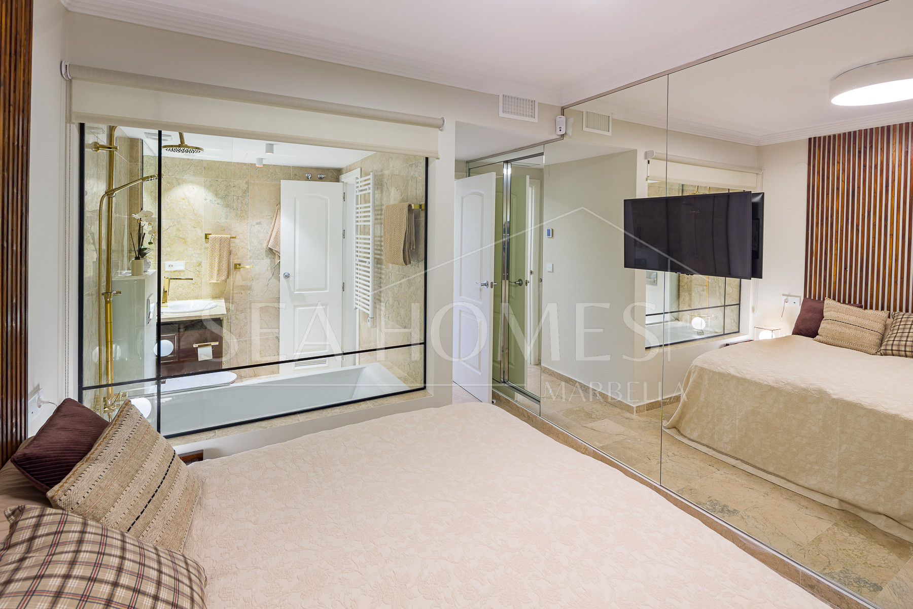 Stunning two bedroom south west facing elevated ground floor apartment in the heart of Marbella's Golden Mile