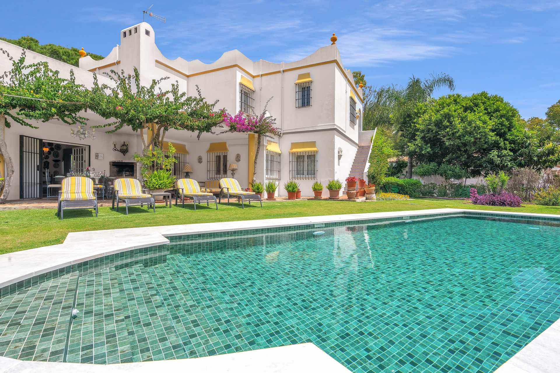 A beautiful, traditional Andalucian villa with pristine gardens, just metres from a quiet sandy beach.