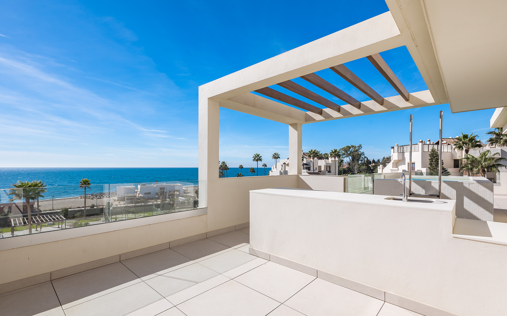 Frontline beach luxury penthouse with panoramic open sea views in Velaya in Estepona