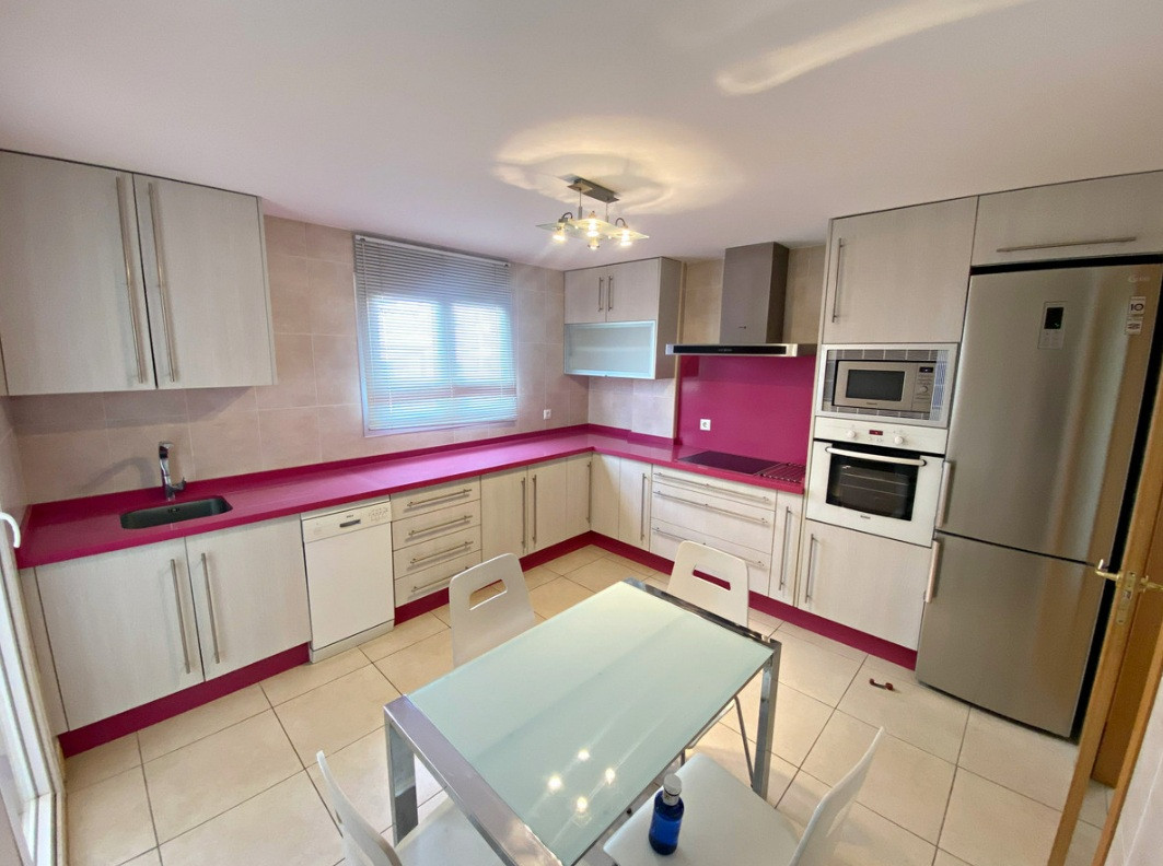 Spacious 4-Bedroom Apartment with Terraces and Parking Space