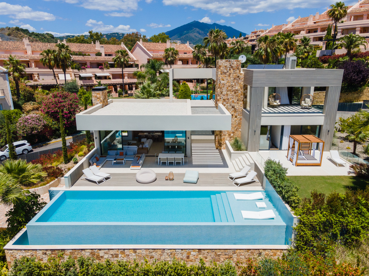 Villa with Elevated position within the prestigious Golf Valley of Nueva Andalucia, providing scenic mountain and sea views.