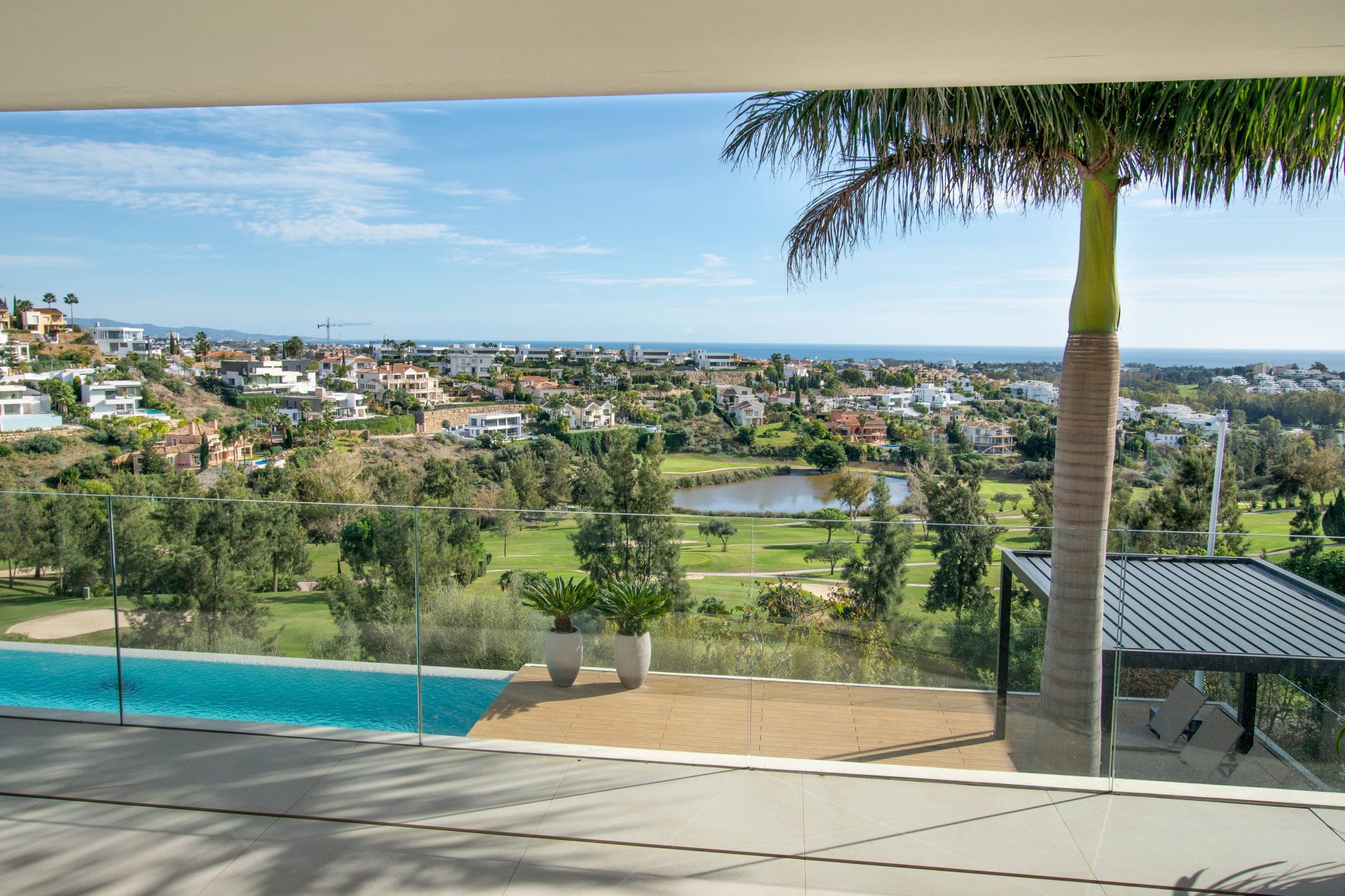 Contemporary Luxury Villa with Panoramic Sea, Golf & Mountain Views in La Alquería, Benahavís