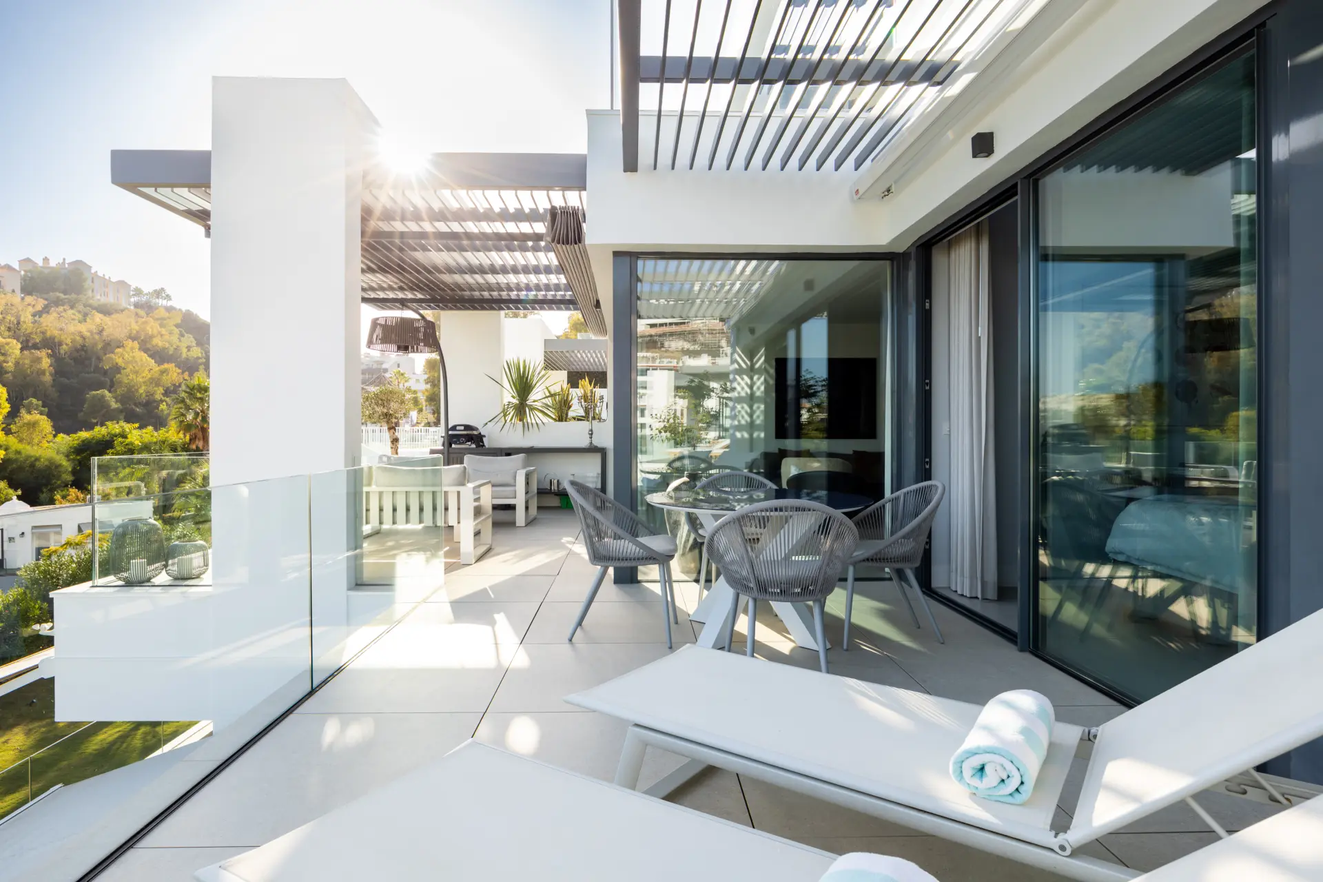Elegant 2-bed, 2-bath apartment in Marbella’s Golf Valley with 112m² interior, 43m² terrace, luxury finishes, pools, gym, concierge & 2 parking spaces.