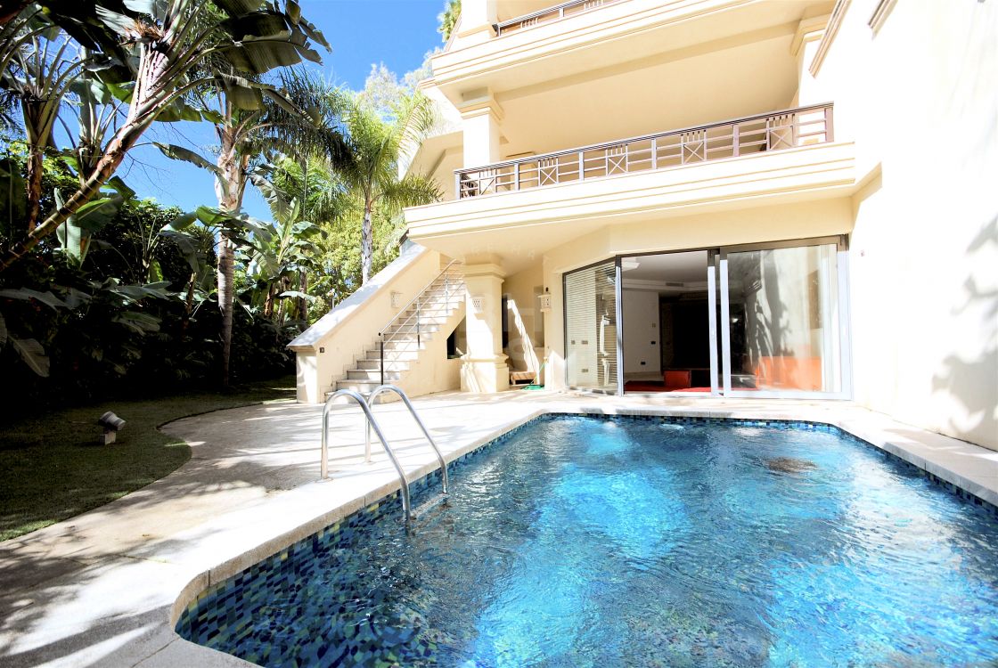 Balinese style duplex apartment with private pool and garden in frontline beach development Laguna de Banus