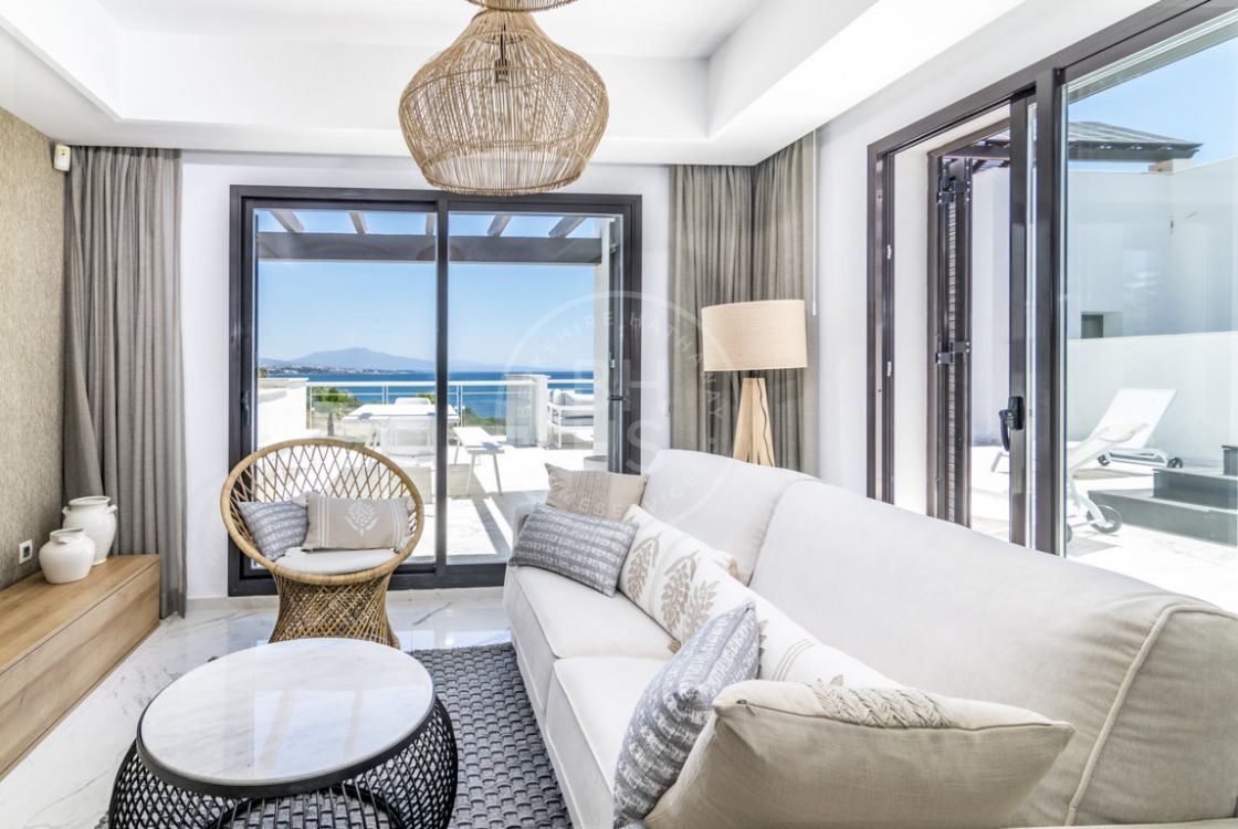 Contemporary beachfront penthouse apartment with unobstructed frontal sea views in Casares
