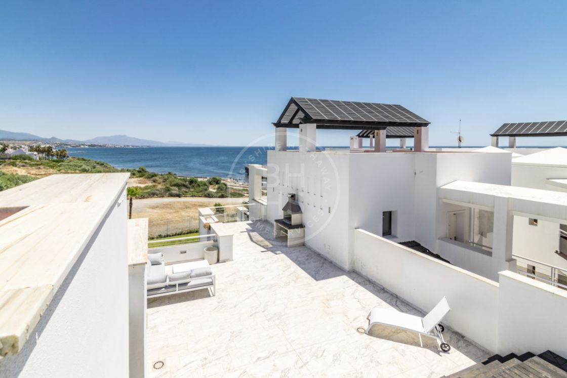 Contemporary beachfront penthouse apartment with unobstructed frontal sea views in Casares