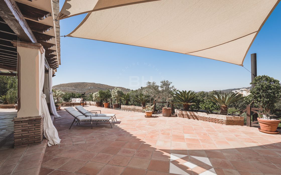 Impressive elegant Andalusian-style front line golf villa with panoramic golf and mountain views in Marbella Club Golf Resort