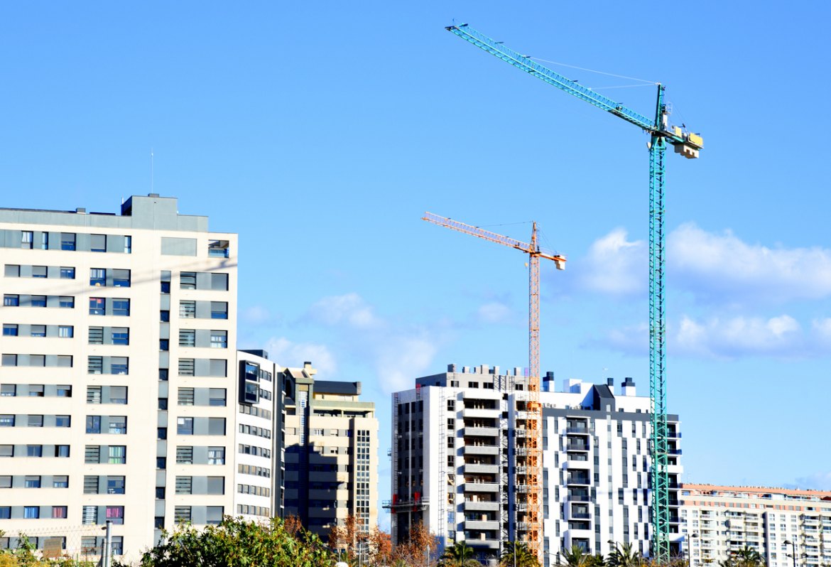 a crane in front of a building