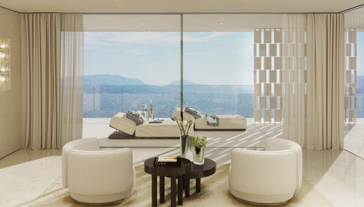 a living room with a view of the ocean