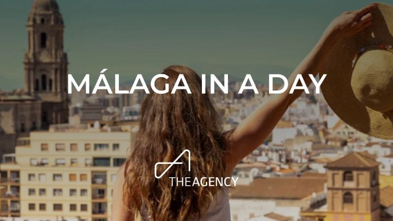 a woman looking over Malaga, with text overlay 'Malaga in a Day'