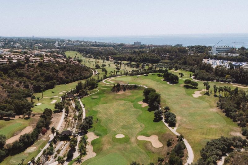 an aerial shot of a gold course in Marbella east