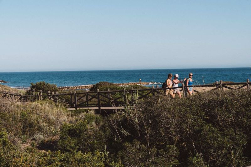 three women walking along the beach of Marbella East