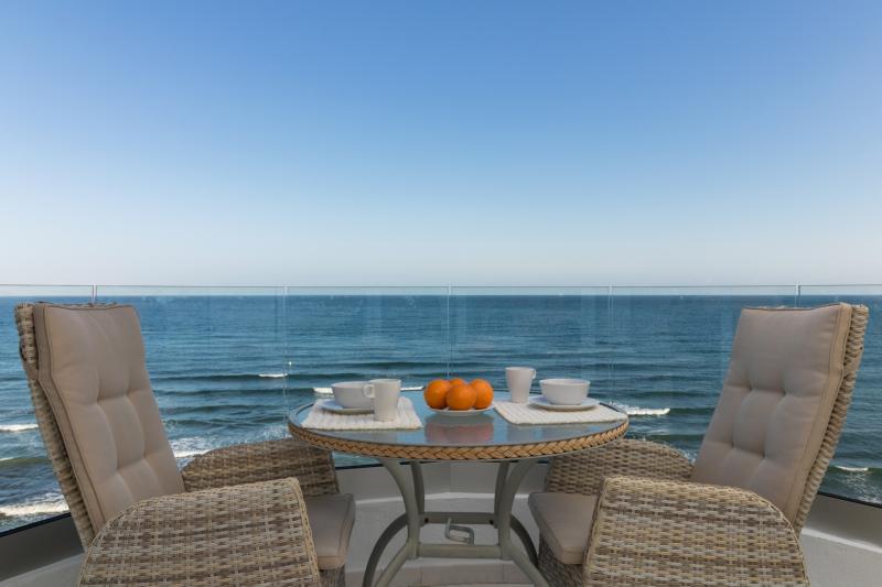 This exclusive 4th-floor apartment is a true coastal sanctuary, offering uninterrupted sea views and direct access to pristine beaches and lush communal gardens.