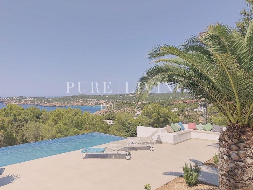 Elegantly renovated villa in Cala Moli, San José, offering sea views and modern luxury in a private and tranquil setting.