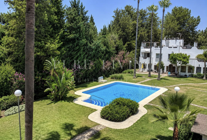 Refined golf-front townhouse with bright interiors & private solarium in prime Soleuropa, Nueva Andalucia
