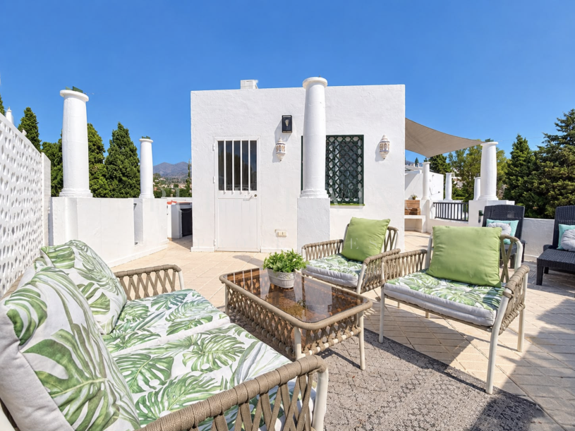 Refined golf-front townhouse with bright interiors & private solarium in prime Soleuropa, Nueva Andalucia