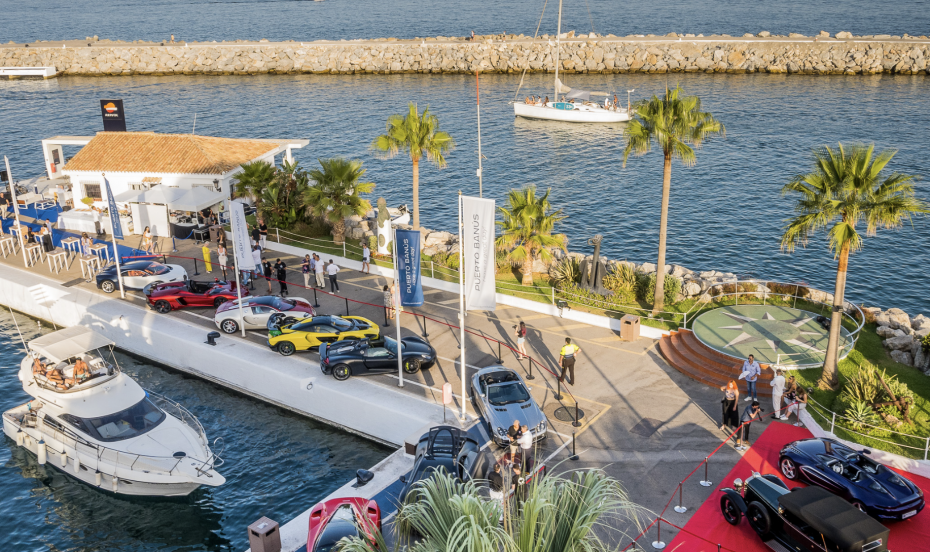 Luxury sports car and yachts at Puerto Banus in Marbella