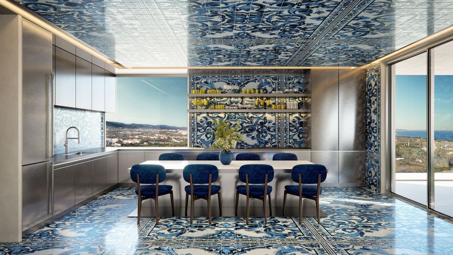 Interior design of a kitchen at Design Hills, Dolce & Gabbana's branded residences on Marbella's Golden Mile. Furniture in blue and white colours, together with Andalusian style tiles with the D&G design brand. Windows with sea views.