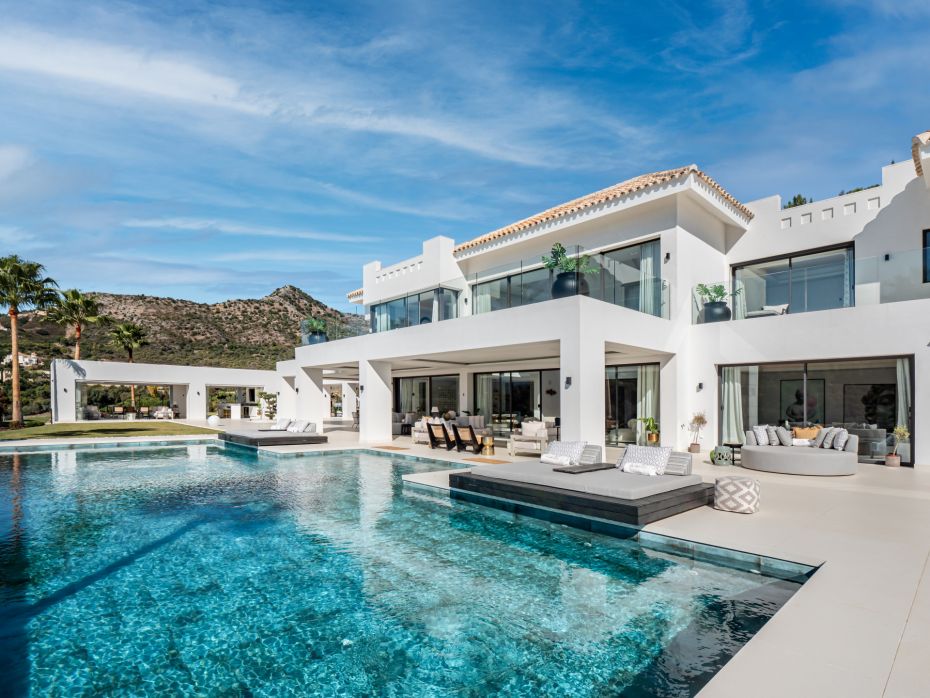 Facade of modern villa in Marbella with balinese style pool 
