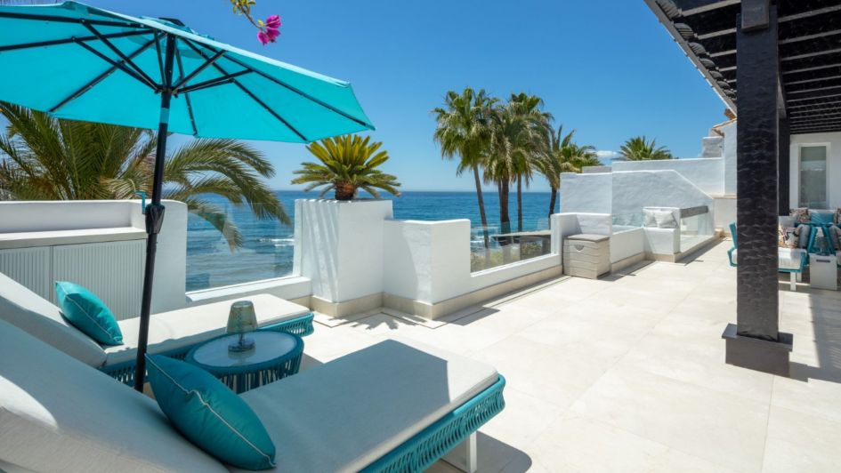 sunlounges in puente romano beachfront terrace