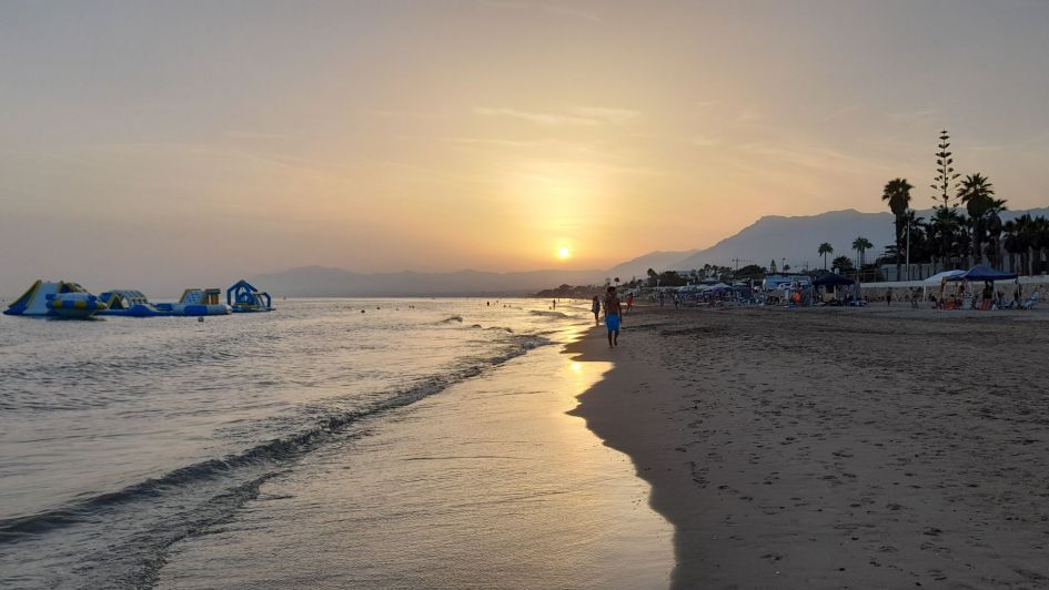 Elviria beach at sunset with summer aquatic park