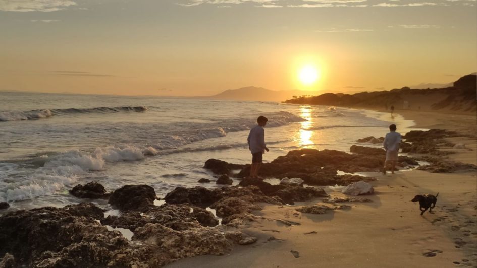 Cabopino beach and rocks at sunset