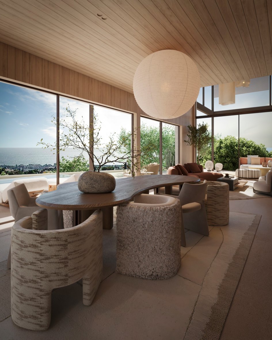 Área de comedor moderna en una amplia y acogedora sala de estar, con acentos de madera y piedra, una mesa redonda, luz natural, vista al océano desde las ventanas, diseño de interiores con muebles de formas orgánicas, una escultura de mármol, sillas modernas, una casa de estilo arquitectónico contemporáneo inspirada en el estilo de los hallazgos de Shigeru, materiales naturales, decoración moderna, al estilo de las revistas de arquitectura, representaciones arquitectónicas