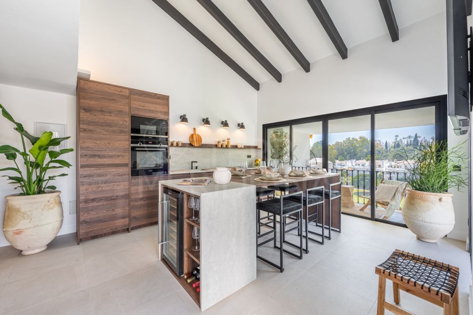Exclusive renovated duplex penthouse with golf course views for sale in Eagles Village, Benahavis