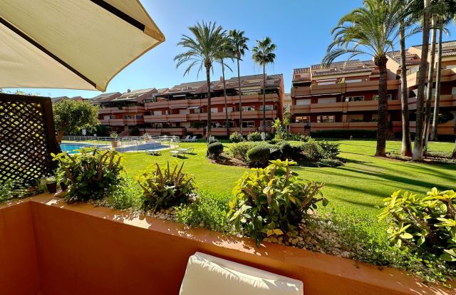 Beachside Apartment in El Embrujo Playa with Tropical Gardens and Pool Views