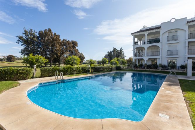 Front line golf apartment located in a beautiful gated community in Mijas Golf!