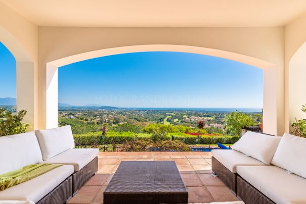 This elegant villa with subtle curb appeal and benefiting from excellent panoramic views