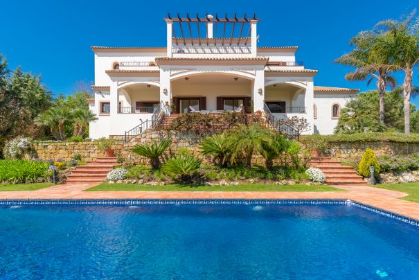 This elegant villa with subtle curb appeal and benefiting from excellent panoramic views