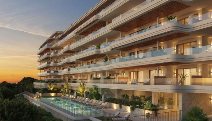 KOSMOS Torremolinos apartment development with terraces and communal pool at sunset