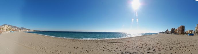 Costa del Sol beach and coastline in Fuengirola under a clear blue sky