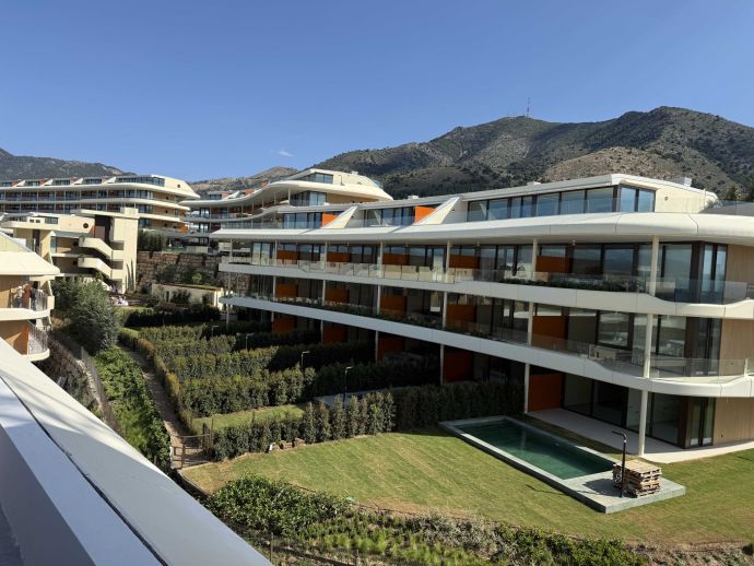 Valley Collection Higuerón residential development with mountain backdrop