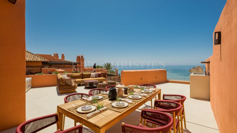 Distinguished front line beach duplex penthouse in La Morera, Marbella East and direct access to the sea