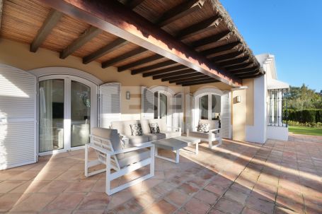 Charming family villa with pretty south facing gardens and lovely views to 2 golf courses
