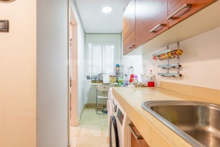 Three-bedroom plus one apartment with a covered terrace, communal pool and private garage in El Polo de Sotogrande.