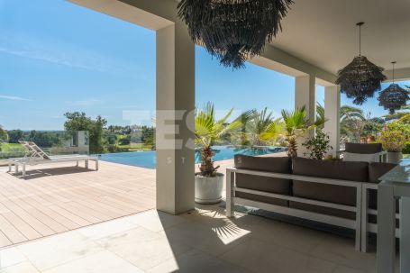 Magnificent 3 storey front line golf villa in La Reserva , with panoramic golf and sea views.