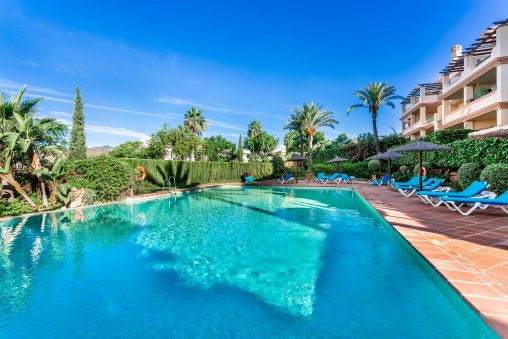 Corner Garden Apartment with Sea Views in Gated Urb
